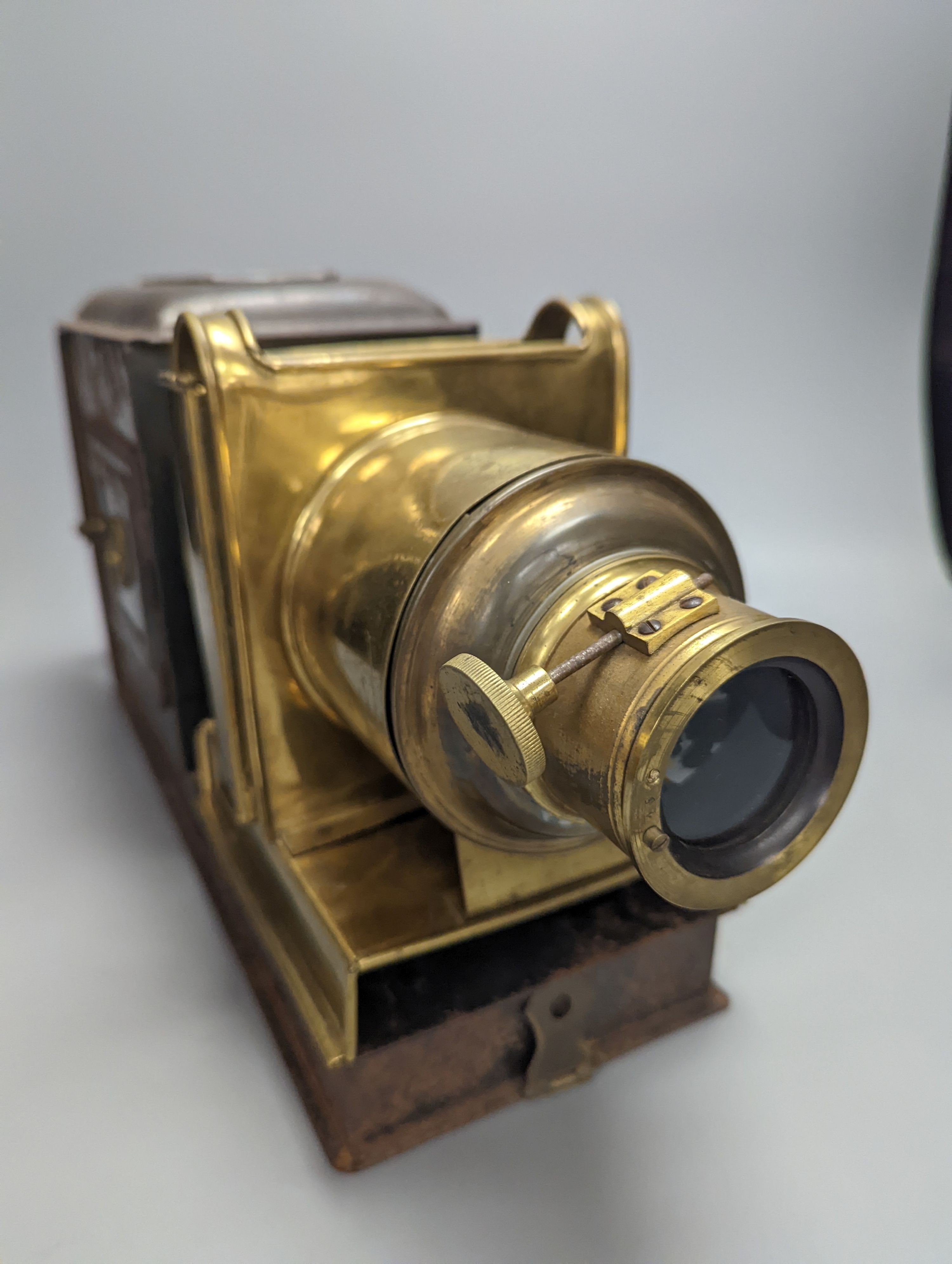 A cased tinplate and pressed brass Magic Lantern, Case 46 cm long